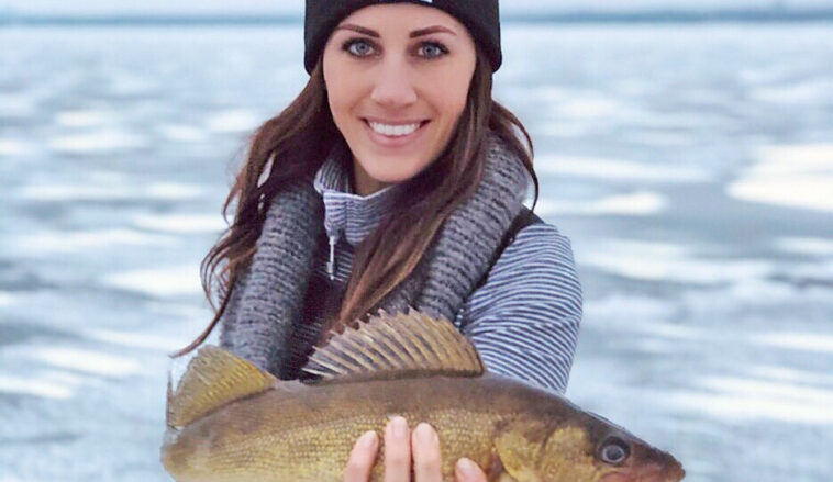 Woman holding Walleye - Ice fishing